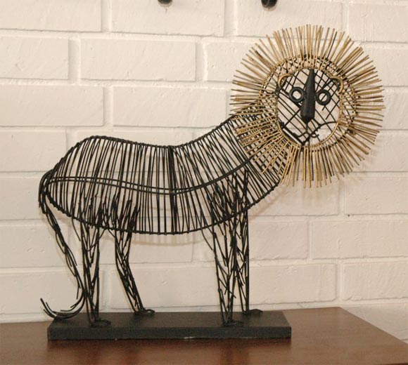 Unique sculpture of iron in the shape of a lion by Curtis Jere.  Whimsical and happy, it is a great gift for any Leo!